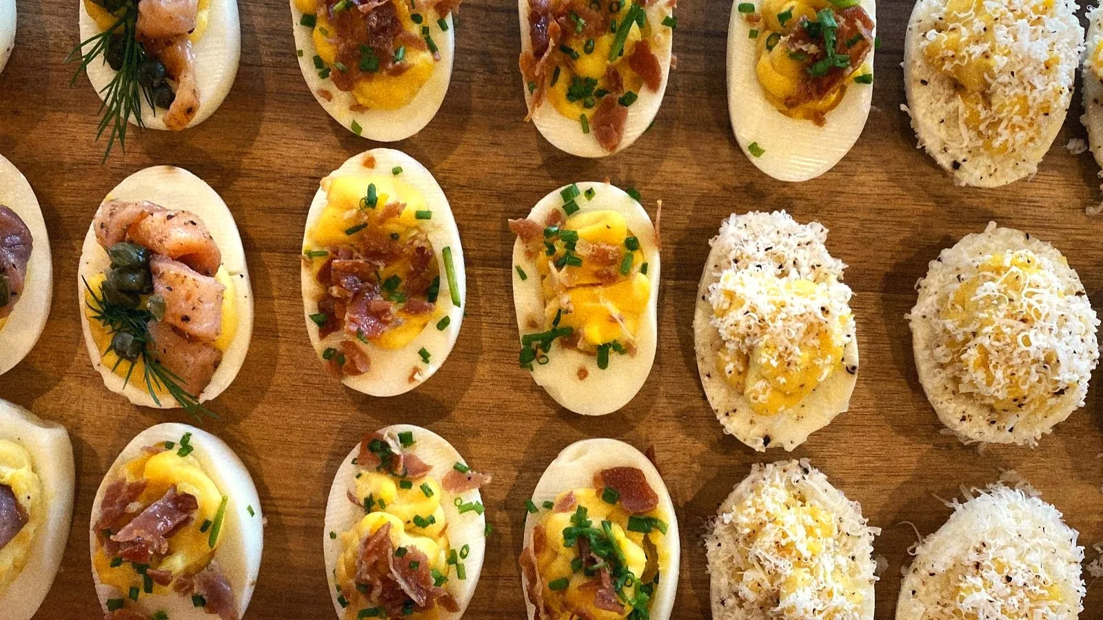 Deviled eggs three ways: smoked salmon and capers, crispy prosciutto, shaved parmesan