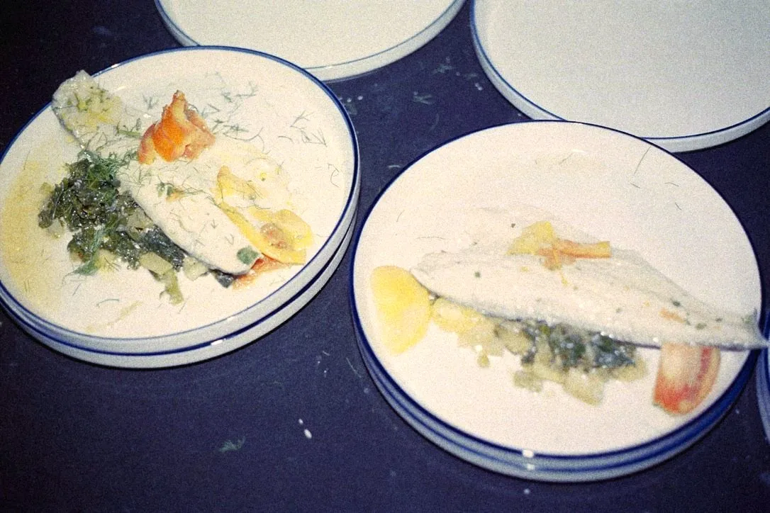 Plated white fish with fennel and roasted peppers