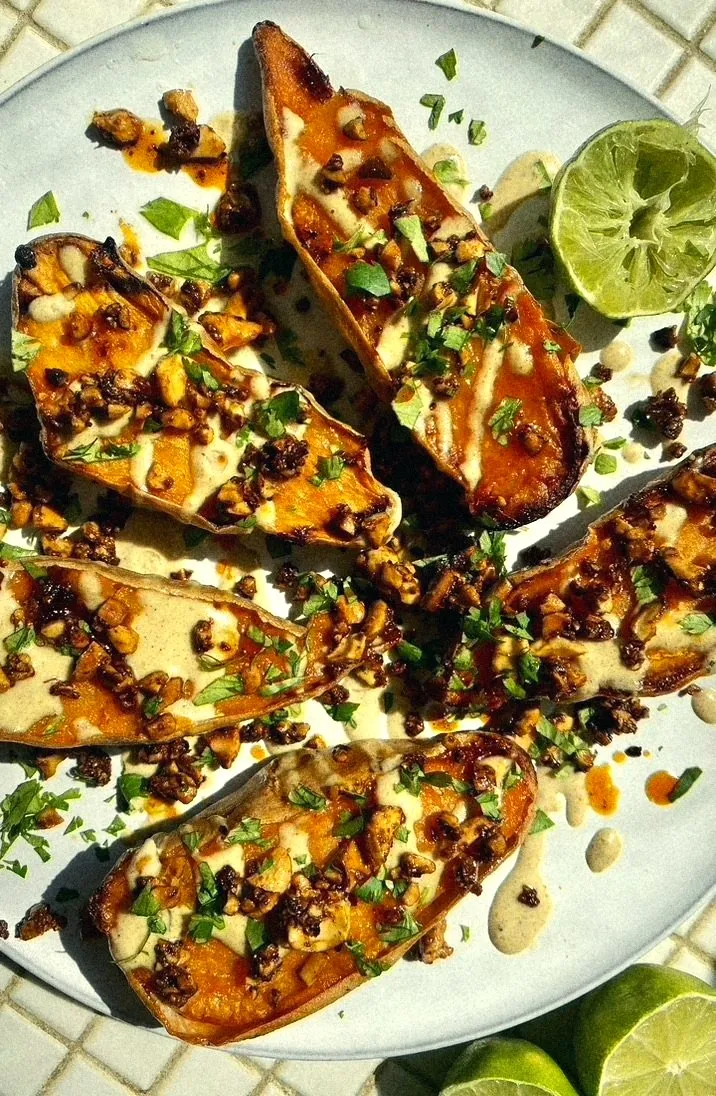 Roasted sweet potatoes with tahini, chili crisp and cilantro