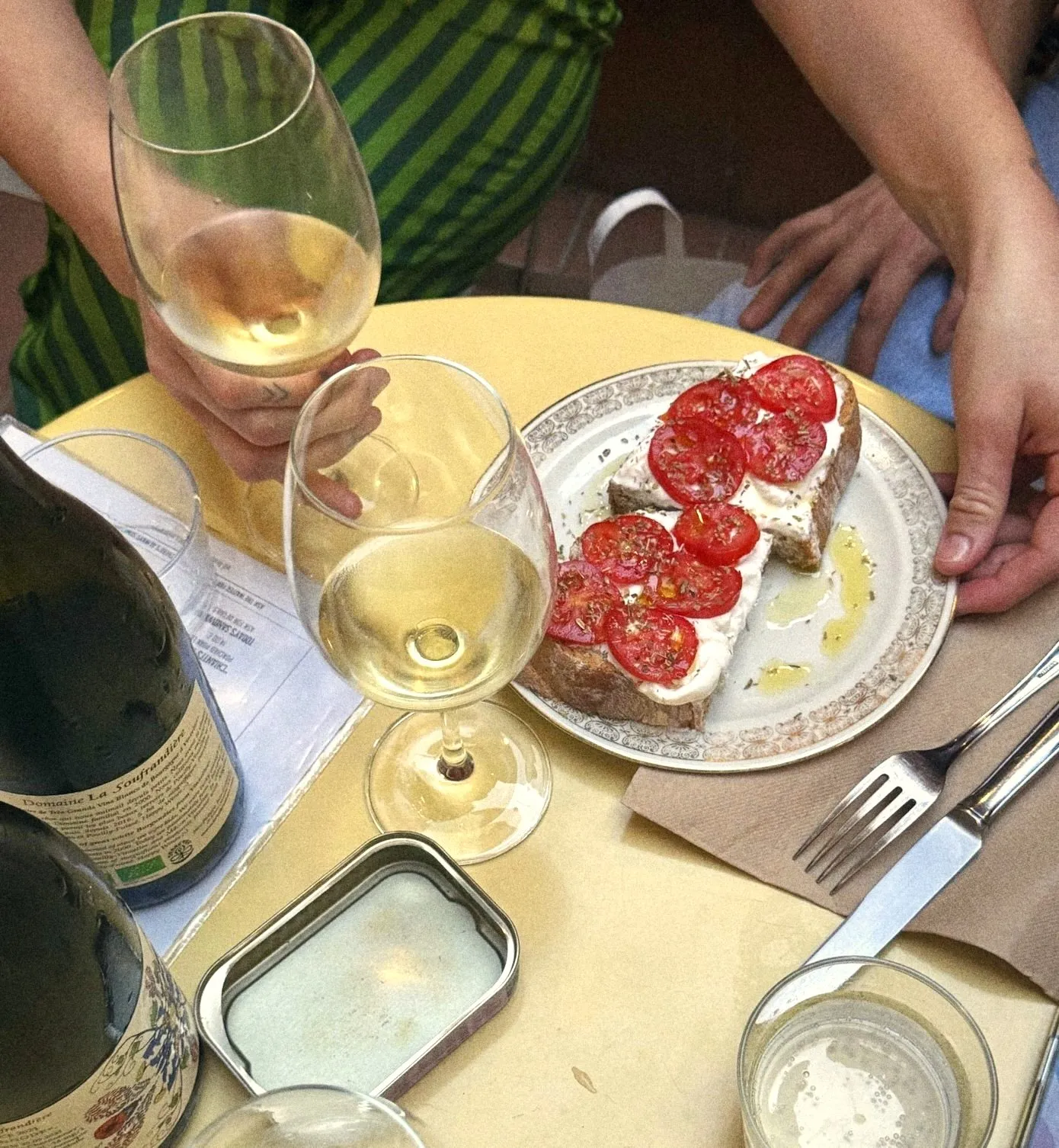 Tomato and ricotta toast with a glass of white wine